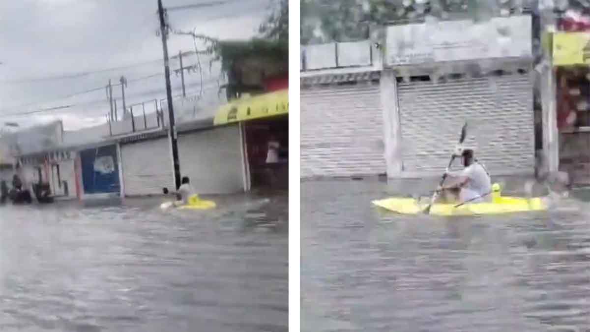 Hombre usa kayak para trasladarse durante fuertes lluvias en Cancún