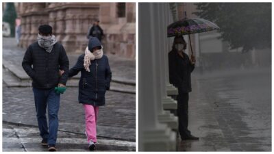 Personas protegiéndose del río y la lluvia con abrigos, bufandas y paraguas