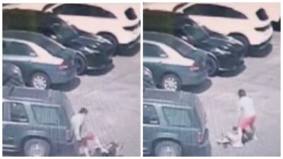Hombre con bermuda roja golpea a una mujer en un estacionamiento