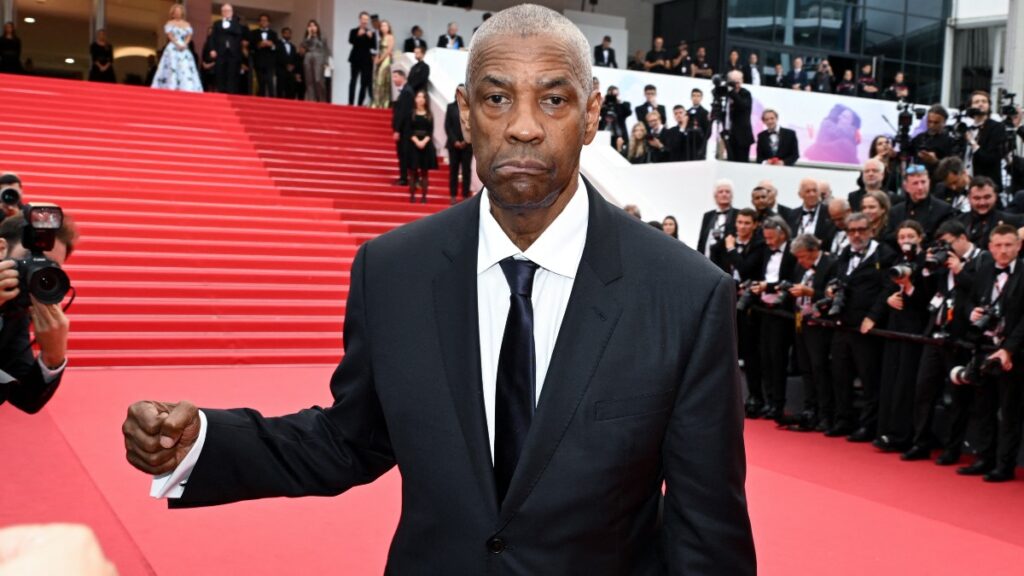 El actor Denzel Washington confronta a fotógrafo en Cannes antes de recibir Palma de Oro honorífica.